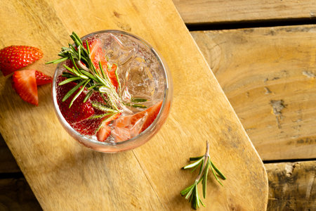 Glasses with drinks and fruits on wooden board and wooden surface. Drinks, cocktails, beverages and party concept.の写真素材