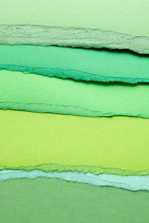 Ripped up pieces of coloured paper with copy space. Abstract paper texture background and communication concept.の写真素材