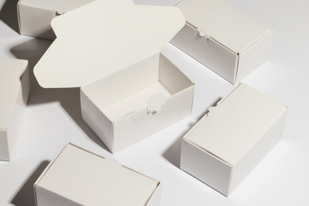 Open cardboard gift box and boxes with copy space over white background. Cyber monday, black friday, online shopping, shipping and global connections concept.の写真素材