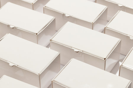 Rows of cardboard gift boxes with copy space over white background. Cyber monday, black friday, online shopping, shipping and global connections concept.の写真素材