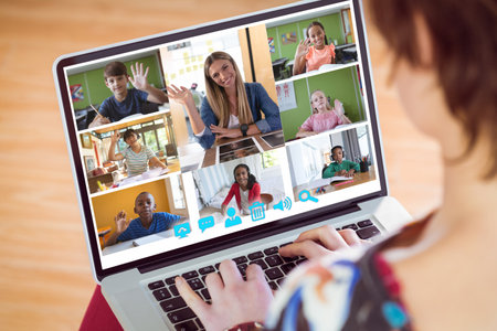 Caucasian girl having a video conference with female teacher and diverse students on laptop. Distant...