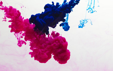 Close up of blue and pink ink in water with copy space on white background. Ink, liquid, shape and colour concept.の写真素材