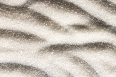 Close up of pattern of white sand and copy space background. Sand, texture, movement, shape and...