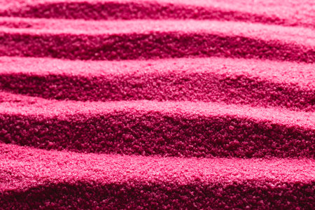 Close up of pattern of pink sand and copy space background. Sand, texture, movement, shape and colour concept.の写真素材