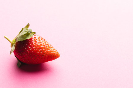 Close up of strawberry and copy space on pink background. Fruit, berry, food, freshness and colour concept.の写真素材