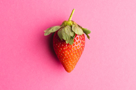 Close up of strawberry and copy space on pink background. Fruit, berry, food, freshness and colour concept.の写真素材