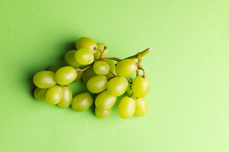 Close up of white grapes and copy space on green background. Fruit, food, freshness and colour...
