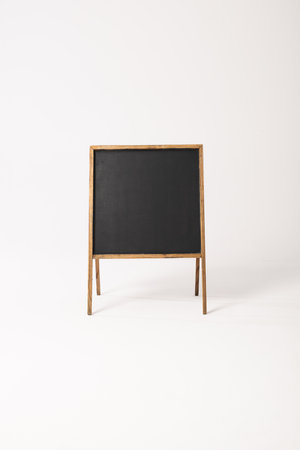 Black sign in wooden frame and copy space on white background. Signage, writing space and...