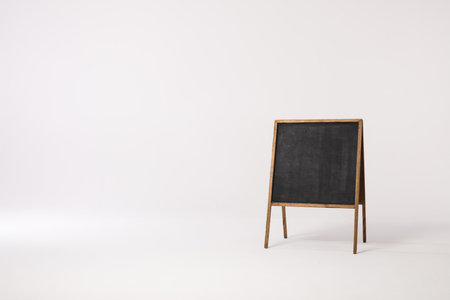 Black sign in wooden frame and copy space on white background. Signage, writing space and advertising concept.の写真素材