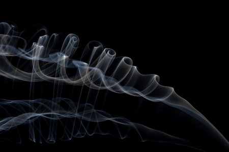 White clouds of smoke with copy space on black background. Halloween, colour, movement and smoke concept.の写真素材