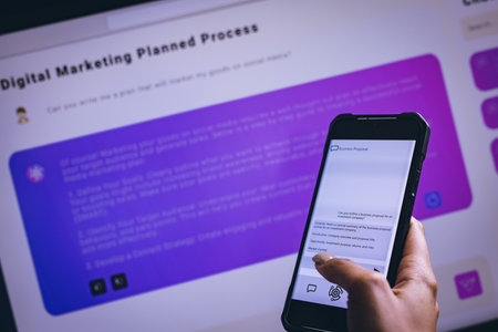 Biracial businesswoman using smartphone and computer with data background. Technology, digital networks, global connections and communication metaverse.の写真素材