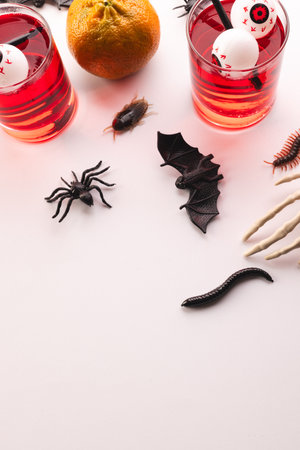 Vertical image of halloween decorations and food with copy space on white background. Fall, autumn, halloween, tradition and celebration concept.の写真素材