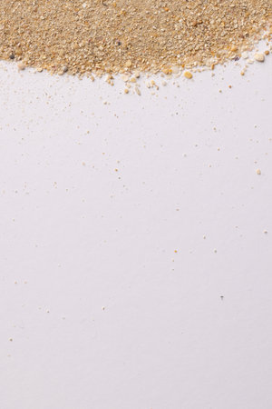 Close up of sand grains and copy space on white background. Sand, texture, shape and colour concept.の写真素材