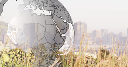 Image of globe over cityscape. Global business, computing and digital interface concept digitally generated image.の写真素材