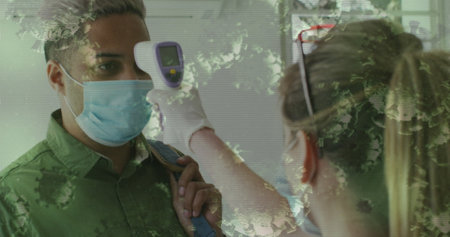 Image of covid-19 cells floating over woman checking mans temperature. Healthcare and protection...