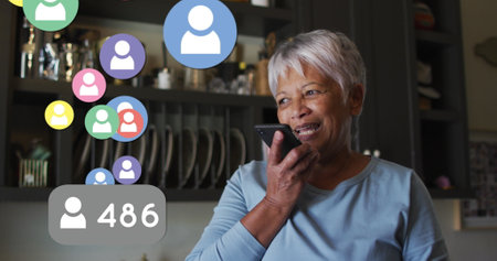 Multiple profile icons floating against african american senior woman talking on smartphone at home....