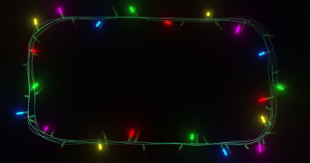 Frame of coloured christmas string lights flashing on black background, copy space. Christmas, decorations, tradition and celebration digitally generated image.の写真素材