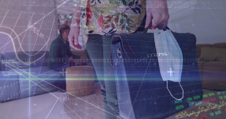 Image of digital interface showing statistics with a man carrying his bag. Healthcare and protection during coronavirus covid 19 pandemic, digitally generated imageの写真素材