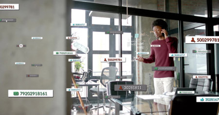 Image of data processing over african american businessman in office. Global finance, business,...