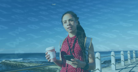 Image of floating numbers over woman drinking coffee and using smartphone on promenade. Digital...