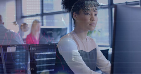 Image of financial data processing over african american businesswoman in office. Global finance,...