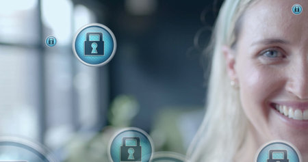 Image of padlock icons data processing over caucasian businesswoman in office. Global finance,...