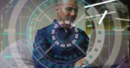 Image of biracial businessman working in office. Global business, finances, computing and data processing concept digitally generated image.の写真素材