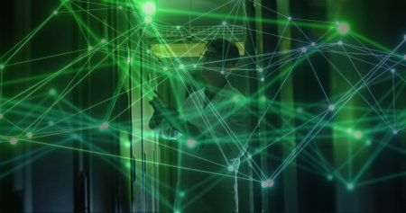 Image of network of connections over asian male it technician using tablet by computer server....