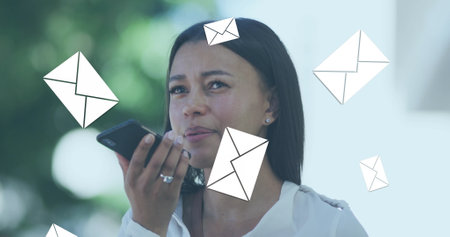 Image of envelope mail icons falling over woman talking on smartphone. global social media...