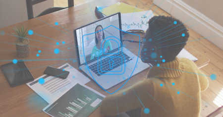 Image of network of connection digital padlock icon over woman using laptop on image call in background. Digital interface global connection and communication concept digitally generated image.の写真素材