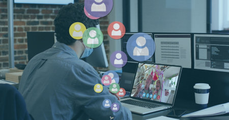 Image of social media people icons over man using laptop on image call in background. Digital...