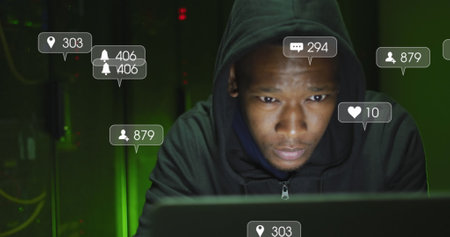 Image of social media reactions over african american man working in server room. network, programming, computers and technology concept digitally generated image.の写真素材