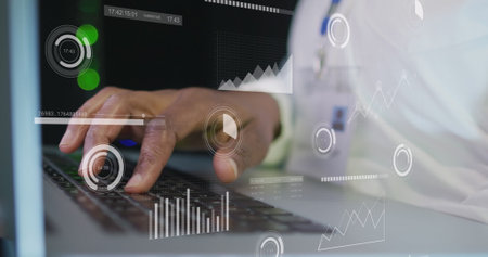 Image of graphs on screens over hands of african american man working on laptop. network,...