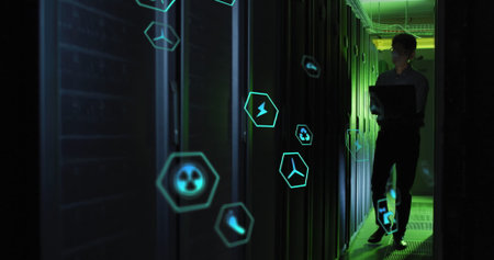 Image of tech icons in hexagones over asian man working in server room. network, programming,...