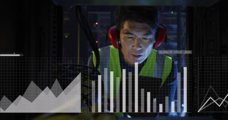 Image of graphs and data over asian man working in server room. network, programming, computers and...