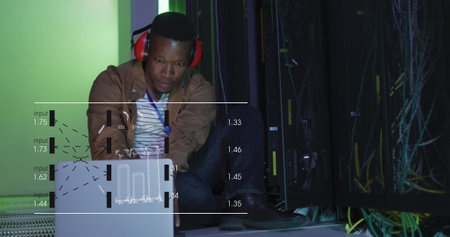 Image of data processing on screens over african american man working in server room. network,...