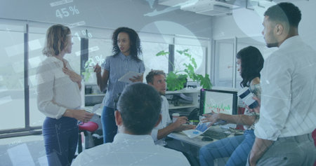 Statistical data processing against group of colleagues working together at office. global business...