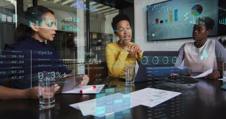 Image of financial data processing over diverse business people in office. Global business, finances, computing and data processing concept digitally generated image.の写真素材