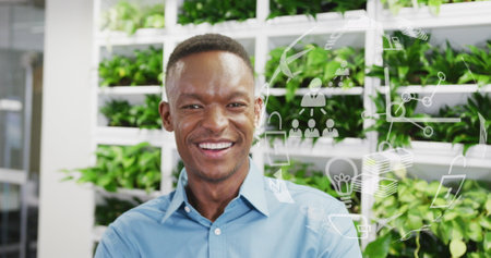 Image of globe with data processing over african american businessman in office. Global networks, business, finances, computing and data processing concept digitally generated image.の写真素材