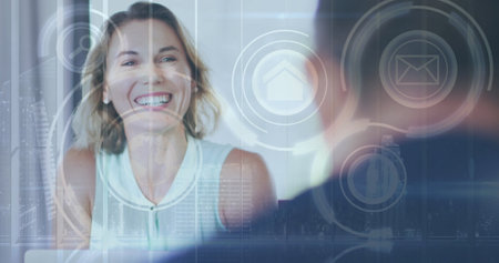 Image of interface with media icons and smiling businesswoman in meeting. communication technology digital interface concept, digitally generated image. withの写真素材