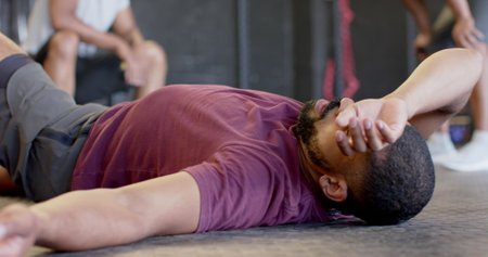 Image of social media notifications over biracial man relaxing after training at gym. Fitness,...