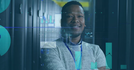 Image of statistic and data processing over african american male it engineer by computer server. Global data processing, servers and cloud computing concept digitally generated image.の写真素材