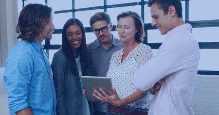 Image of network of people icons over diverse business people in office. Global business, digital interface, connections, computing and data processing concept digitally generated image.の写真素材