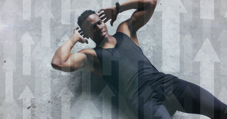 Multiple arrows against african american man performing crunches exercise in the gym. sports and fitness conceptの写真素材
