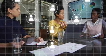 Image of network with icons over diverse business people in office. Global business, digital interface, connections, computing and data processing concept digitally generated image.の写真素材