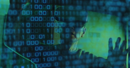 Image of binary coding data processing over asian male it engineer in vr headset. Global data processing, servers and cloud computing concept digitally generated image.の写真素材
