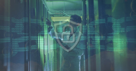 Image of chain and data processing over asian male it engineer by computer servers. Global data processing, servers and cloud computing concept digitally generated image.の写真素材