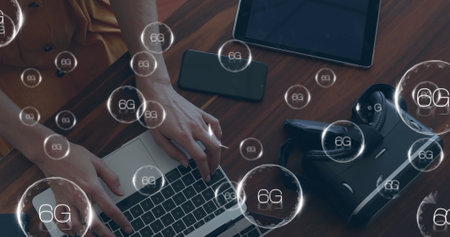 Image of 6g texts over caucasian woman using laptop. Global business and digital interface concept digitally generated image.の写真素材