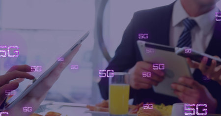 Image of 5g texts over caucasian business people using smartphone. Global business and digital interface concept digitally generated image.の写真素材