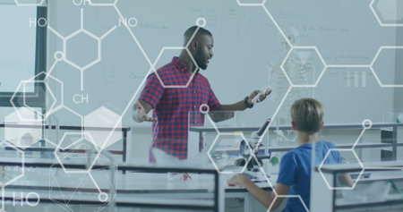 Image of elemental diagrams over african american male teacher and pupils in science class. Science,...